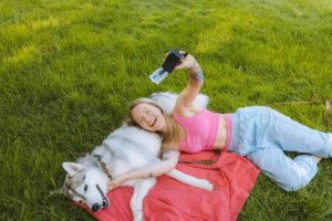 Dog lover taking selfie with dog